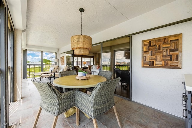 dining area featuring a textured ceiling