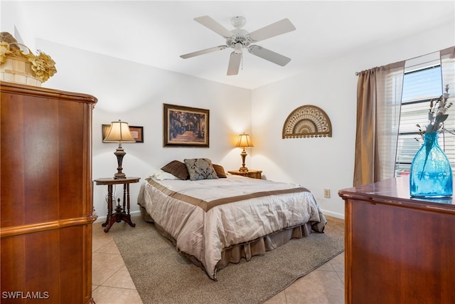 tiled bedroom with ceiling fan