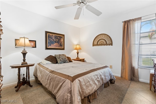 bedroom featuring light tile patterned flooring and ceiling fan