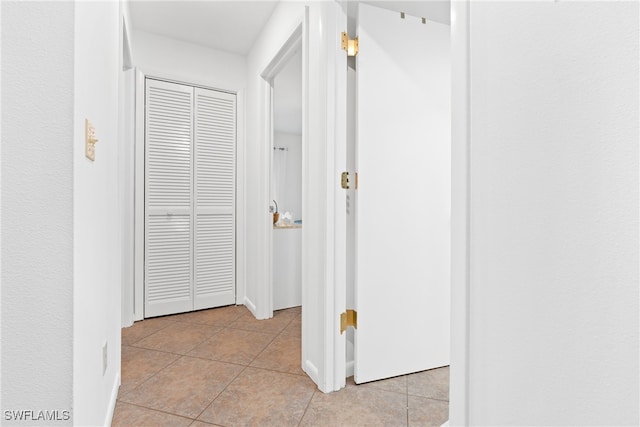 corridor with light tile patterned floors