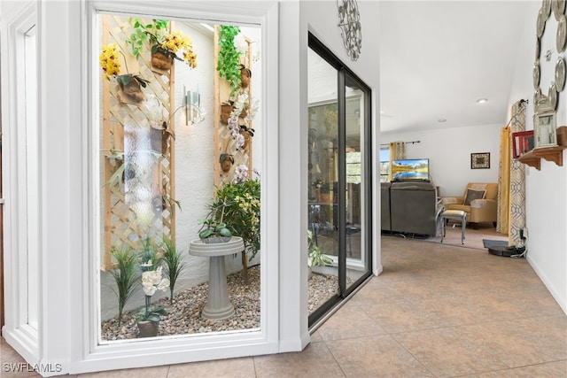 entryway featuring light tile patterned flooring