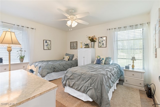 tiled bedroom with ceiling fan