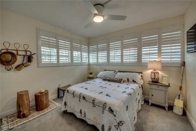 bedroom featuring ceiling fan and light colored carpet