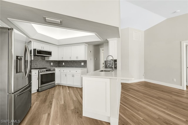 17585 Blackfriar Dr, Fort Myers, FL 33908 - kitchen featuring white cabinets, tasteful backsplash, stainless steel appliances, and sink