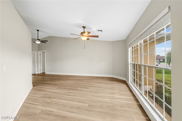 17585 Blackfriar Dr, Fort Myers, FL 33908 - spare room featuring lofted ceiling, light wood-type flooring, and ceiling fan