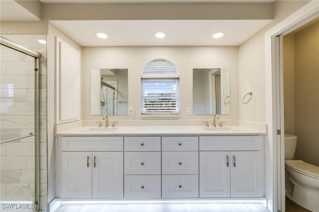 17585 Blackfriar Dr, Fort Myers, FL 33908 - bathroom featuring vanity, toilet, an enclosed shower, and hardwood / wood-style floors
