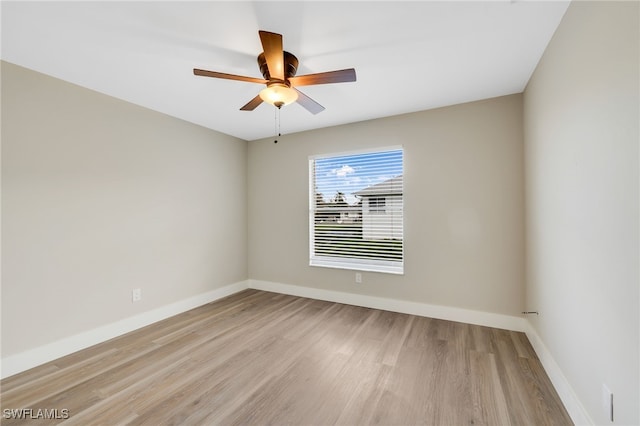 spare room featuring ceiling fan and light hardwood / wood-style flooring