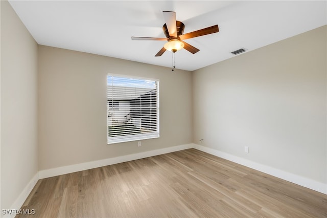 unfurnished room featuring ceiling fan and light wood-type flooring