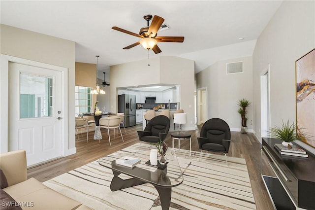17585 Blackfriar Dr, Fort Myers, FL 33908 - living room featuring hardwood / wood-style floors and ceiling fan with notable chandelier