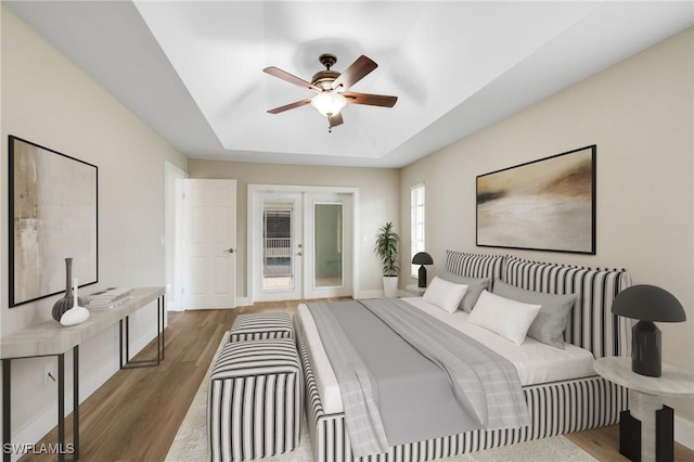 17585 Blackfriar Dr, Fort Myers, FL 33908 - bedroom with french doors, hardwood / wood-style flooring, and ceiling fan