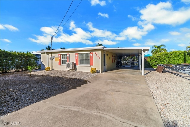 single story home with a carport