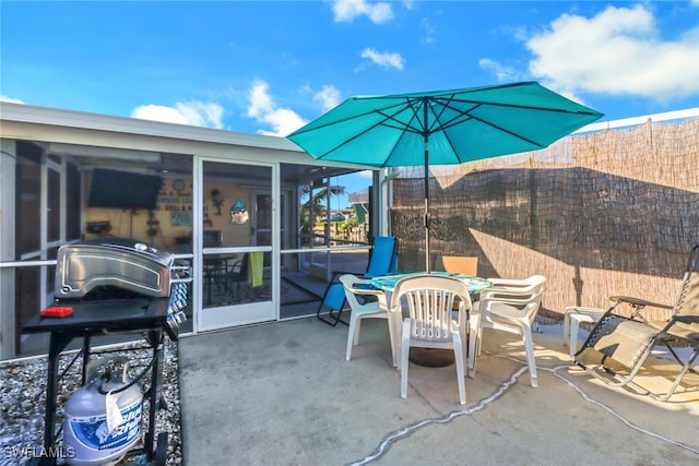 view of patio with a sunroom