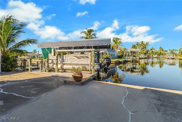 view of patio featuring a dock and a water view