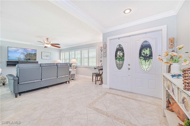 entrance foyer with ceiling fan, crown molding, and french doors