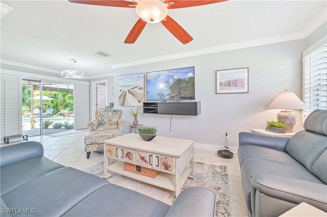 tiled living room featuring ceiling fan, ornamental molding, and a healthy amount of sunlight