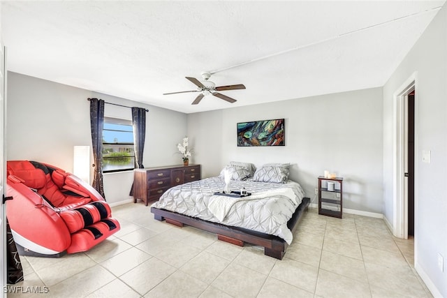 tiled bedroom with ceiling fan