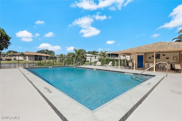 view of swimming pool featuring a patio area