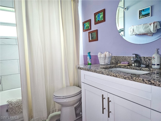 full bathroom featuring vanity, toilet, and shower / bathtub combination with curtain