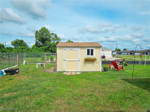 view of outbuilding featuring a lawn