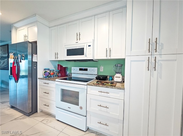 kitchen featuring stone counters, white appliances, and white cabinetry