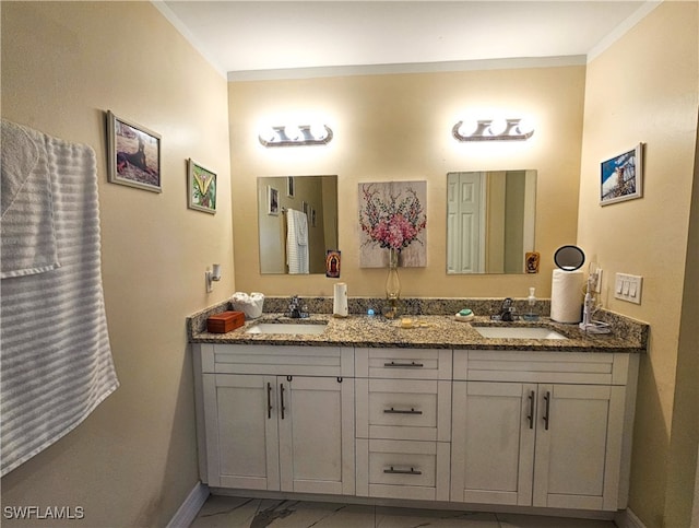 bathroom featuring ornamental molding and vanity