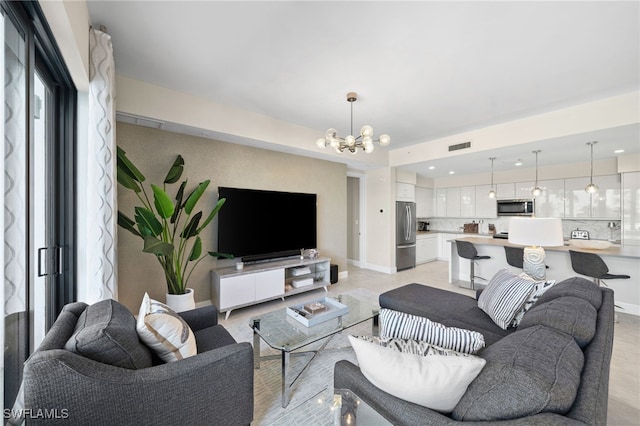 living room with a notable chandelier