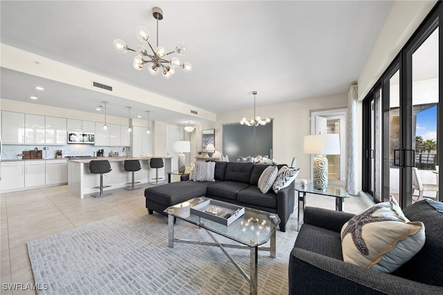 tiled living room featuring a chandelier