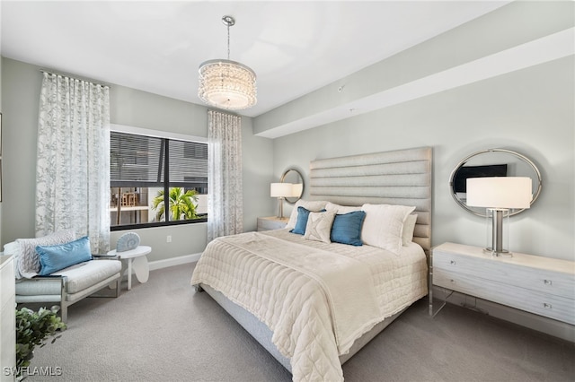 bedroom featuring carpet floors and an inviting chandelier