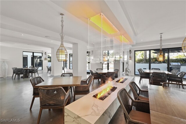 dining room featuring concrete flooring