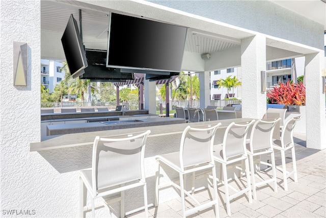 view of patio with an outdoor bar