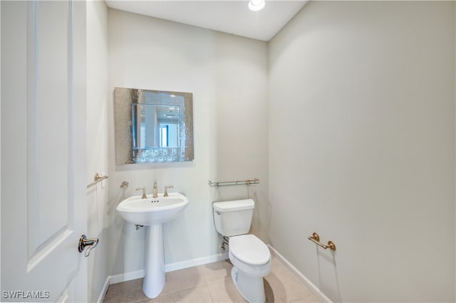 bathroom featuring tile patterned floors and toilet