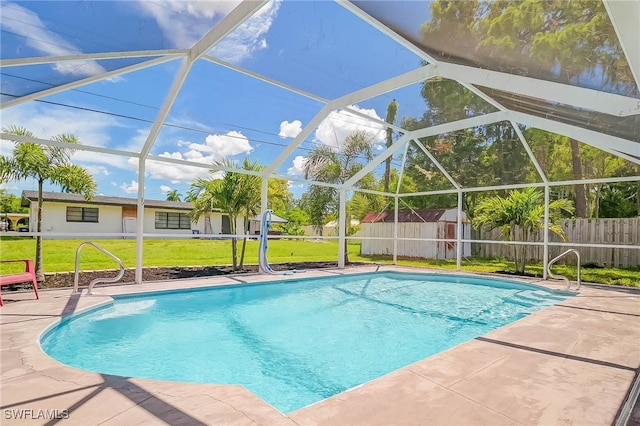 view of pool with a patio, a storage shed, a lanai, and a lawn