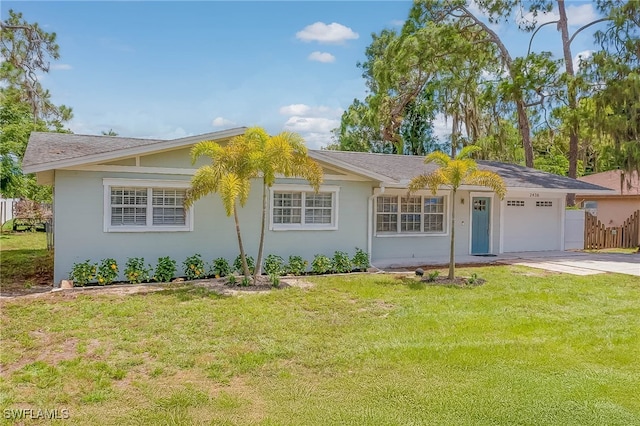 ranch-style home with a front yard and a garage