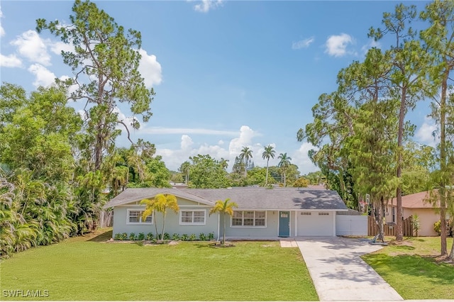 single story home featuring a front yard and a garage