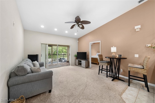 living room with ceiling fan, light colored carpet, and lofted ceiling