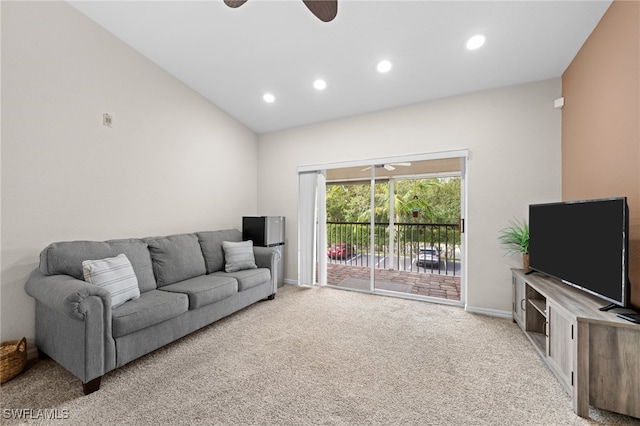 living room with light carpet, ceiling fan, and lofted ceiling