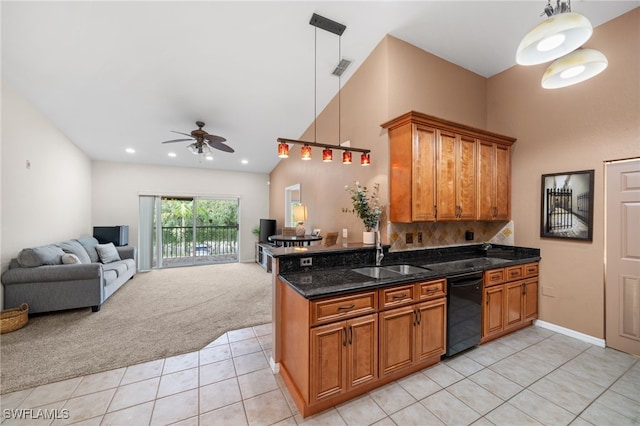 kitchen featuring sink, pendant lighting, black dishwasher, and light carpet