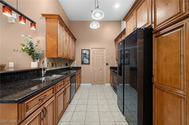 27083 Matheson Ave Unit 202, Bonita Springs, FL 34135 - kitchen with black appliances, a sink, brown cabinets, and light tile patterned flooring