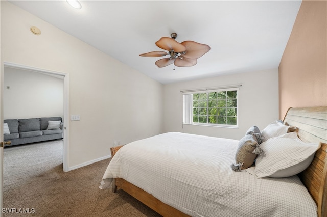 carpeted bedroom featuring ceiling fan and vaulted ceiling