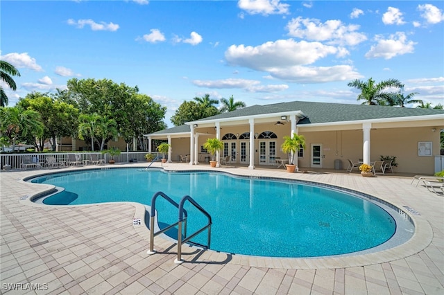 view of pool with ceiling fan and a patio area