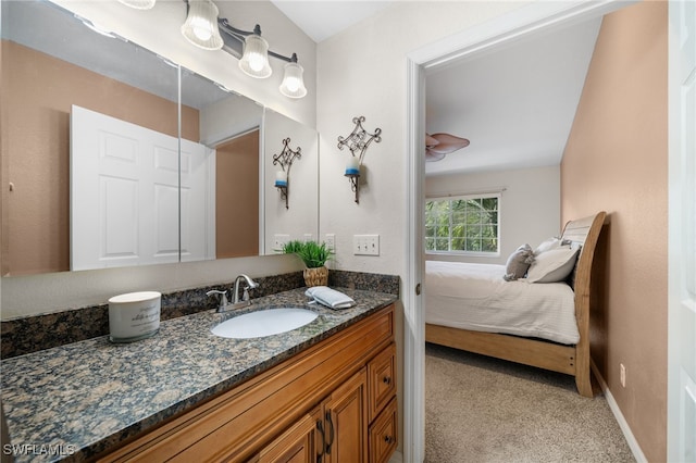 27083 Matheson Ave Unit 202, Bonita Springs, FL 34135 - bathroom with vanity, baseboards, and ensuite bathroom