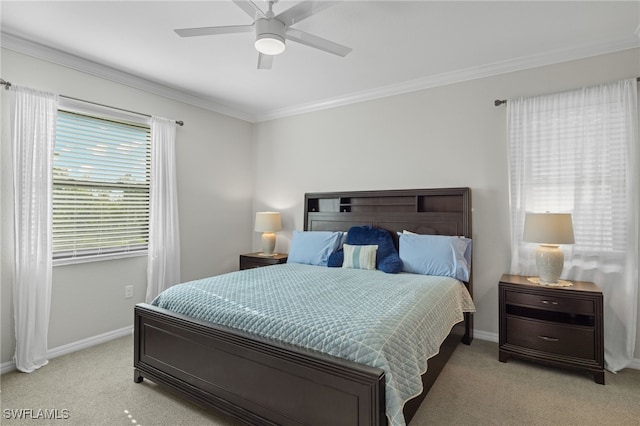 carpeted bedroom with ceiling fan and crown molding