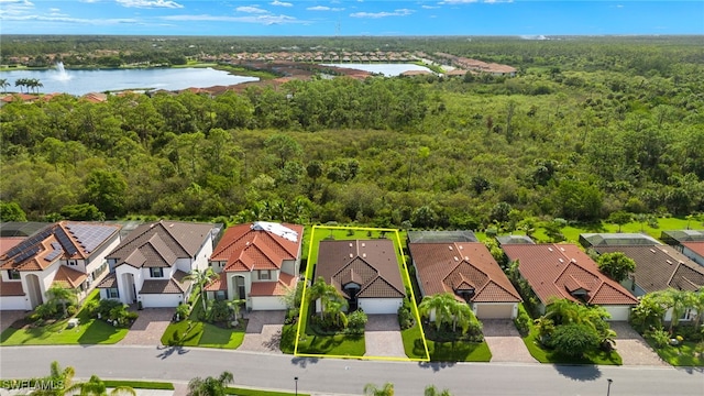 drone / aerial view with a water view