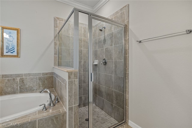 bathroom with independent shower and bath and ornamental molding