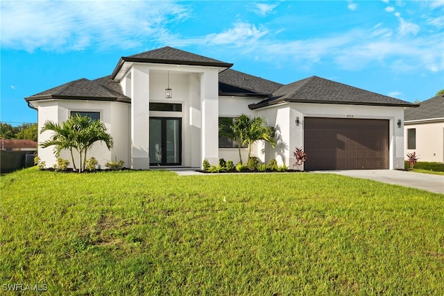 prairie-style house with an attached garage, french doors, and stucco siding