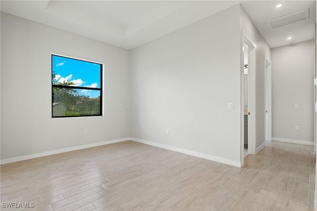 spare room with light hardwood / wood-style flooring