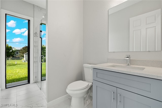 bathroom with baseboards, marble finish floor, toilet, and vanity