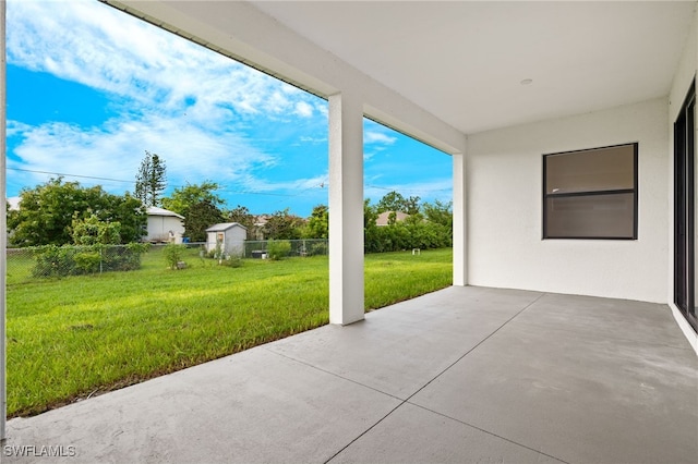 view of patio featuring fence