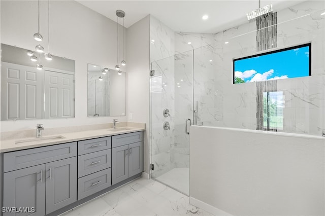 full bathroom featuring a sink, a marble finish shower, double vanity, and marble finish floor