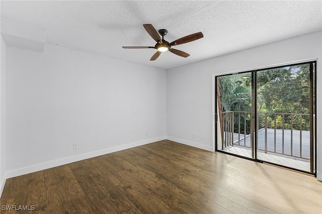 spare room featuring ceiling fan, hardwood / wood-style flooring, and a textured ceiling